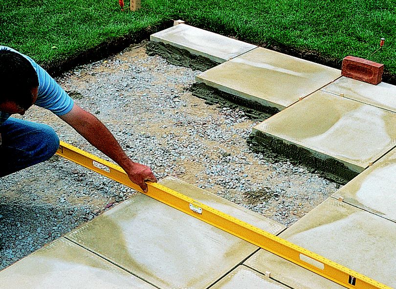 laying concrete paving slabs on sand